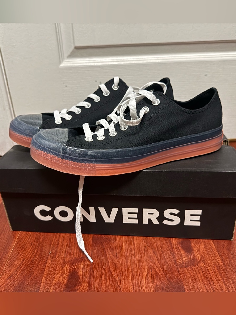 Converse Low Top Sneakers in Black with Orange Gum Sole